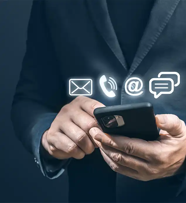 A man holding a mobile phone with the communication logos hovering the phone.